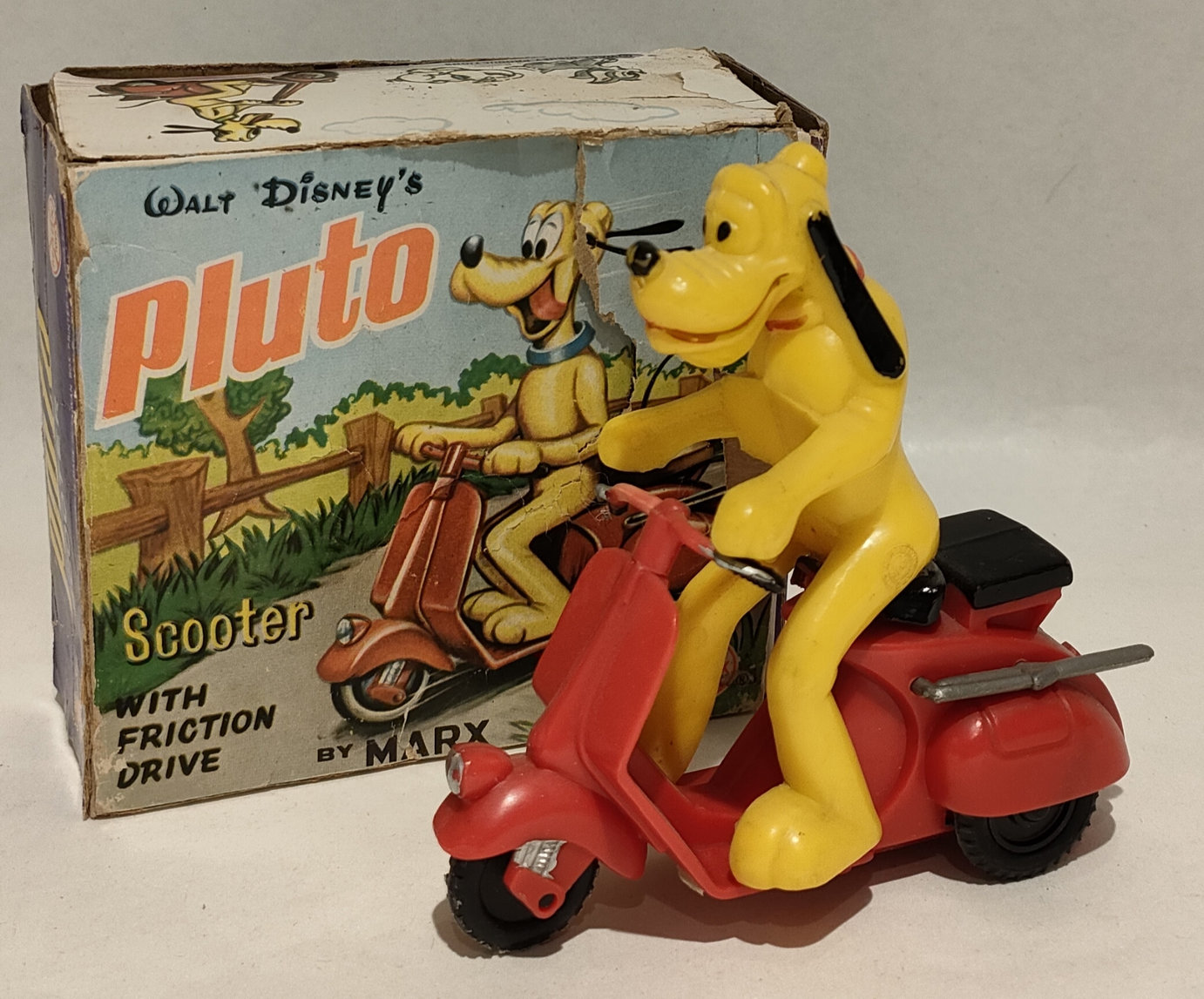 Pluto in Vespa – In Box